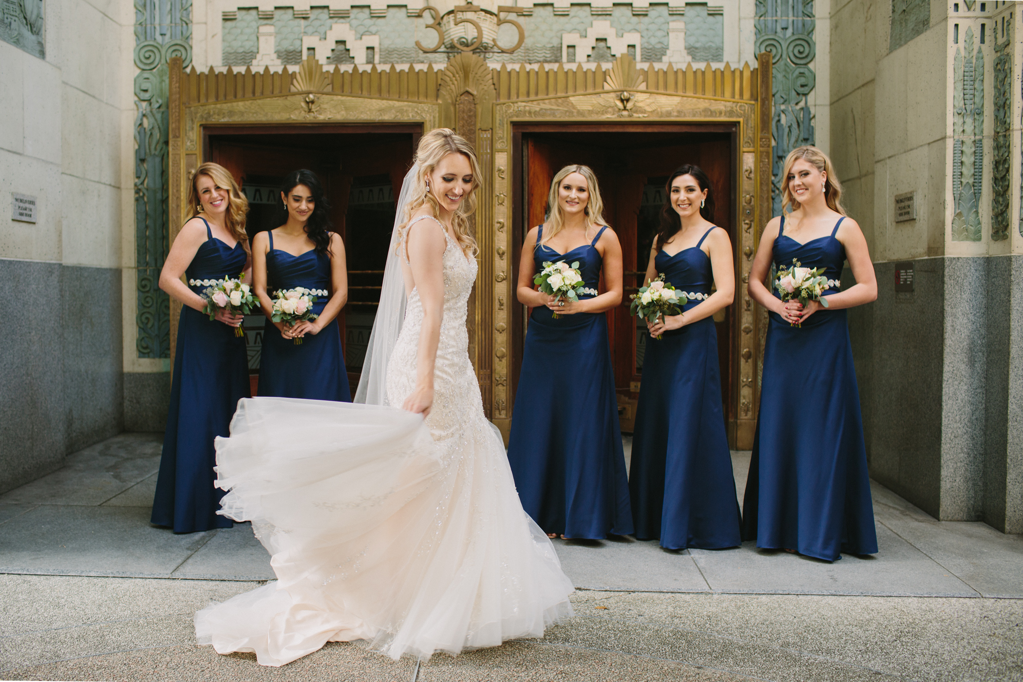 Bridesmaids in front of the Marine Building