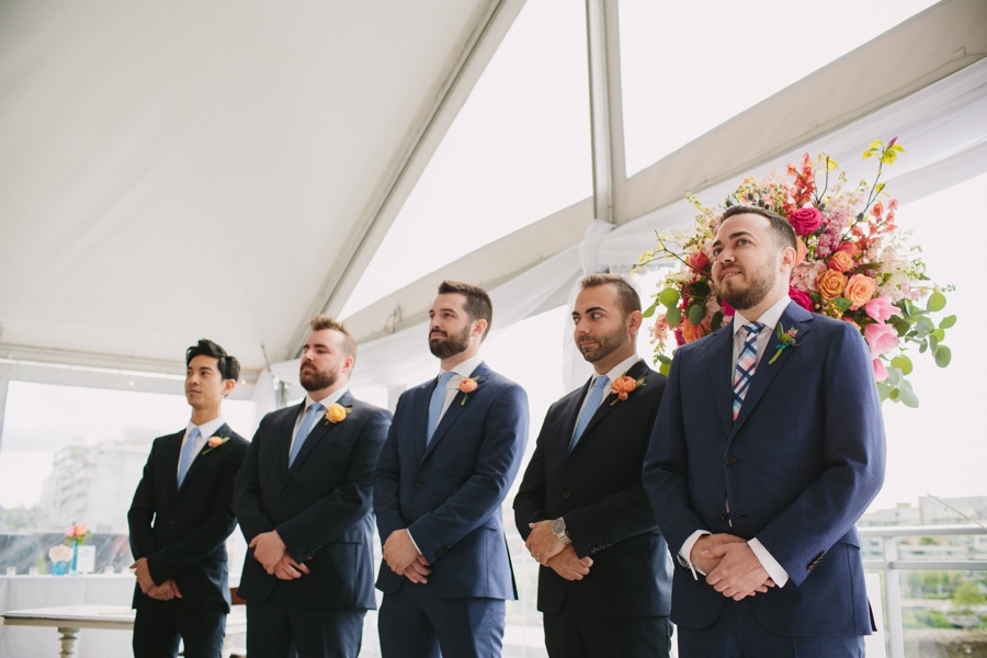 Groomsmen during ceremony at Science World in Vancouver