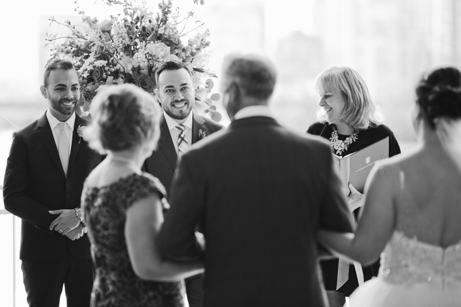 Groom's reaction to bride at Science World Wedding Ceremony