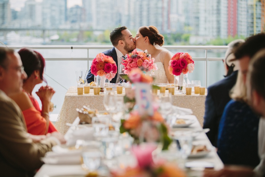 Bride and Groom Kiss During Reception at Science World