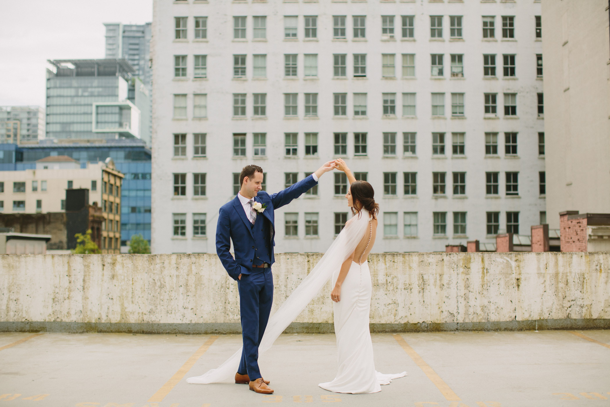 Bride and Groom Dancing with the Seymor Building