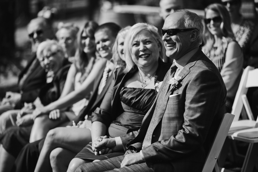 Parents of the bride laughing at ceremony