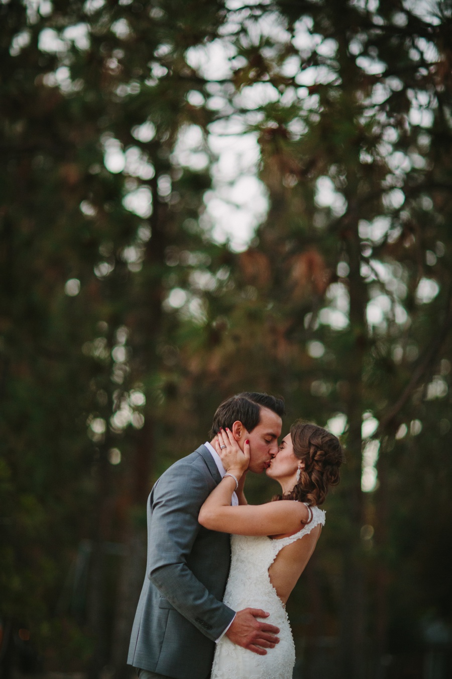 Kaleden Bride and Groom Kissing in Trees