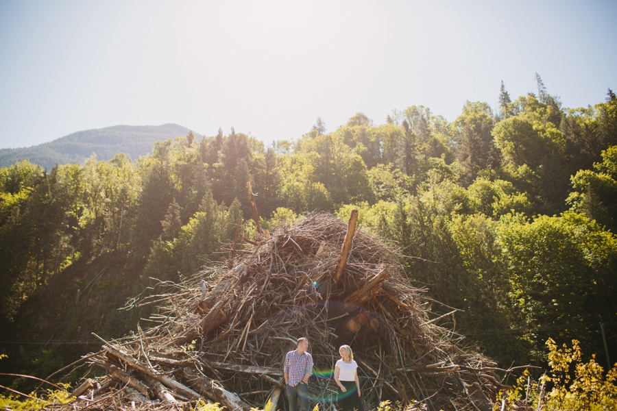 Couples portrait with log pile