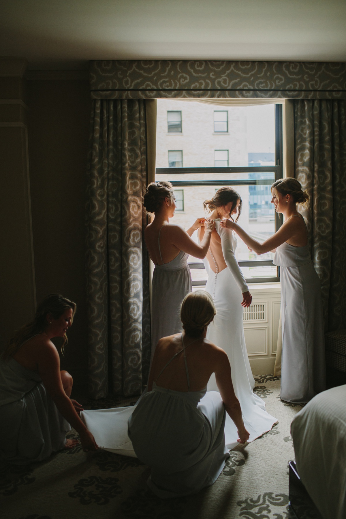 Bride with bridesmaids at Fairmont Hotel Vancouver