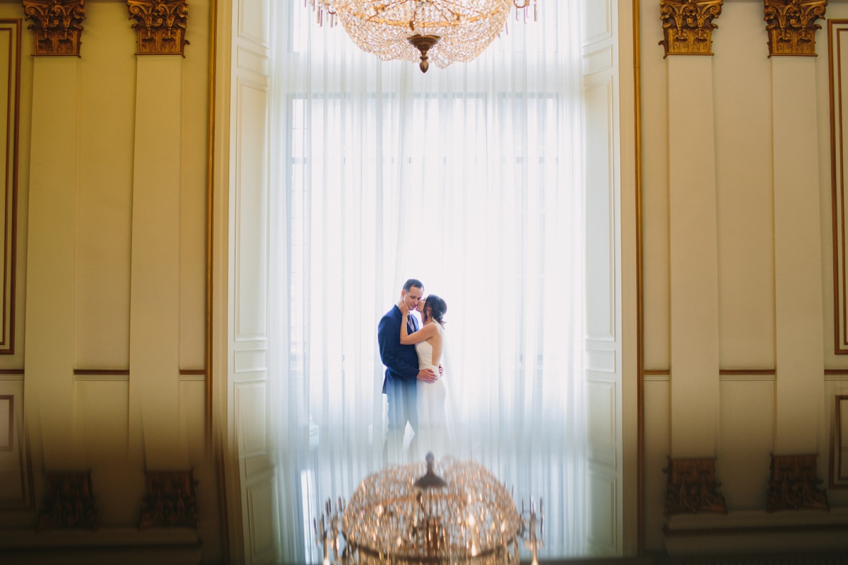 Bride and groom with Fairmont Hotel Vancouver grand staircase