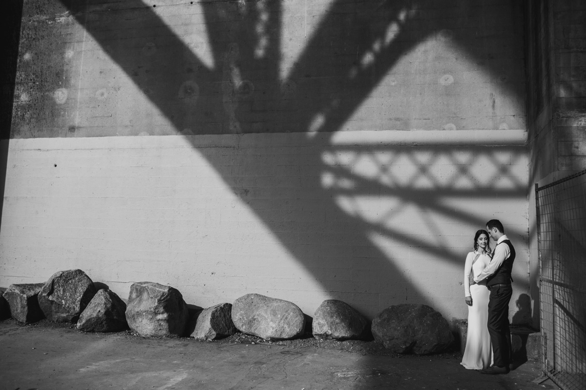 Wedding portrait under Burrard Street Bridge in Vancouver