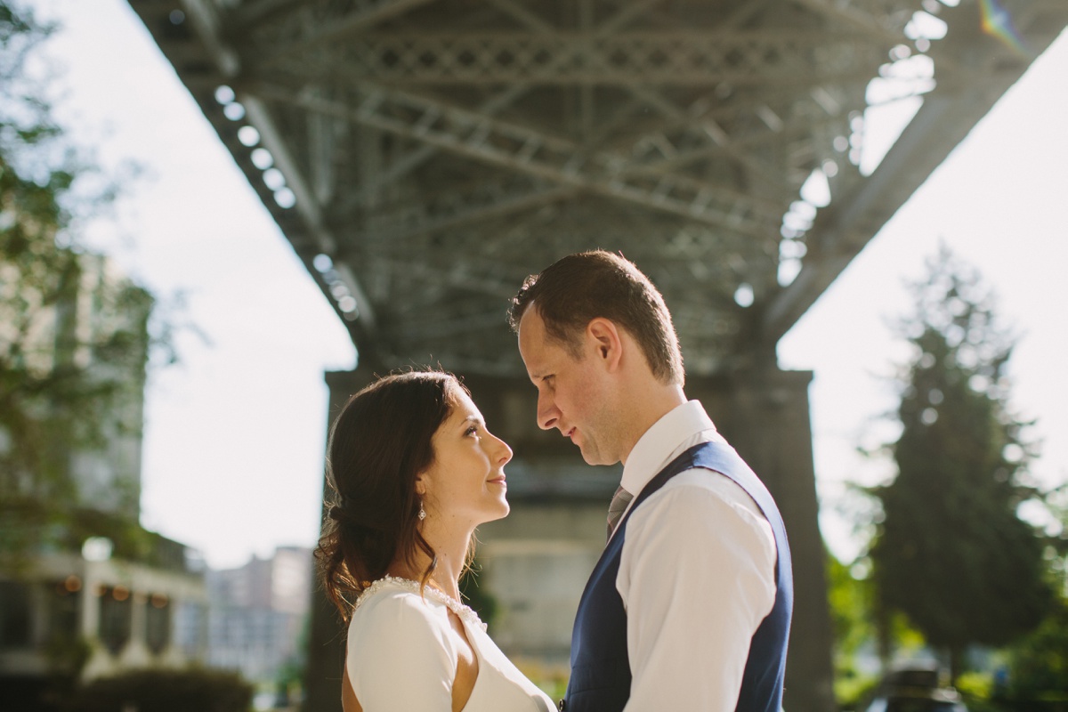 Wedding portrait under Burrard Street Bridge in Vancouver