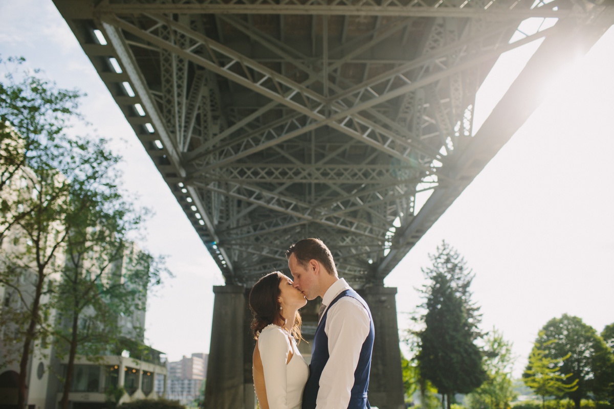 Wedding portrait under Burrard Street Bridge in Vancouver