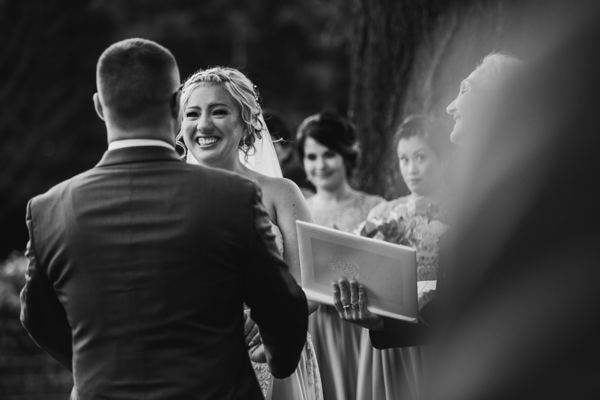 Bride crying during ceremony at Glass House E